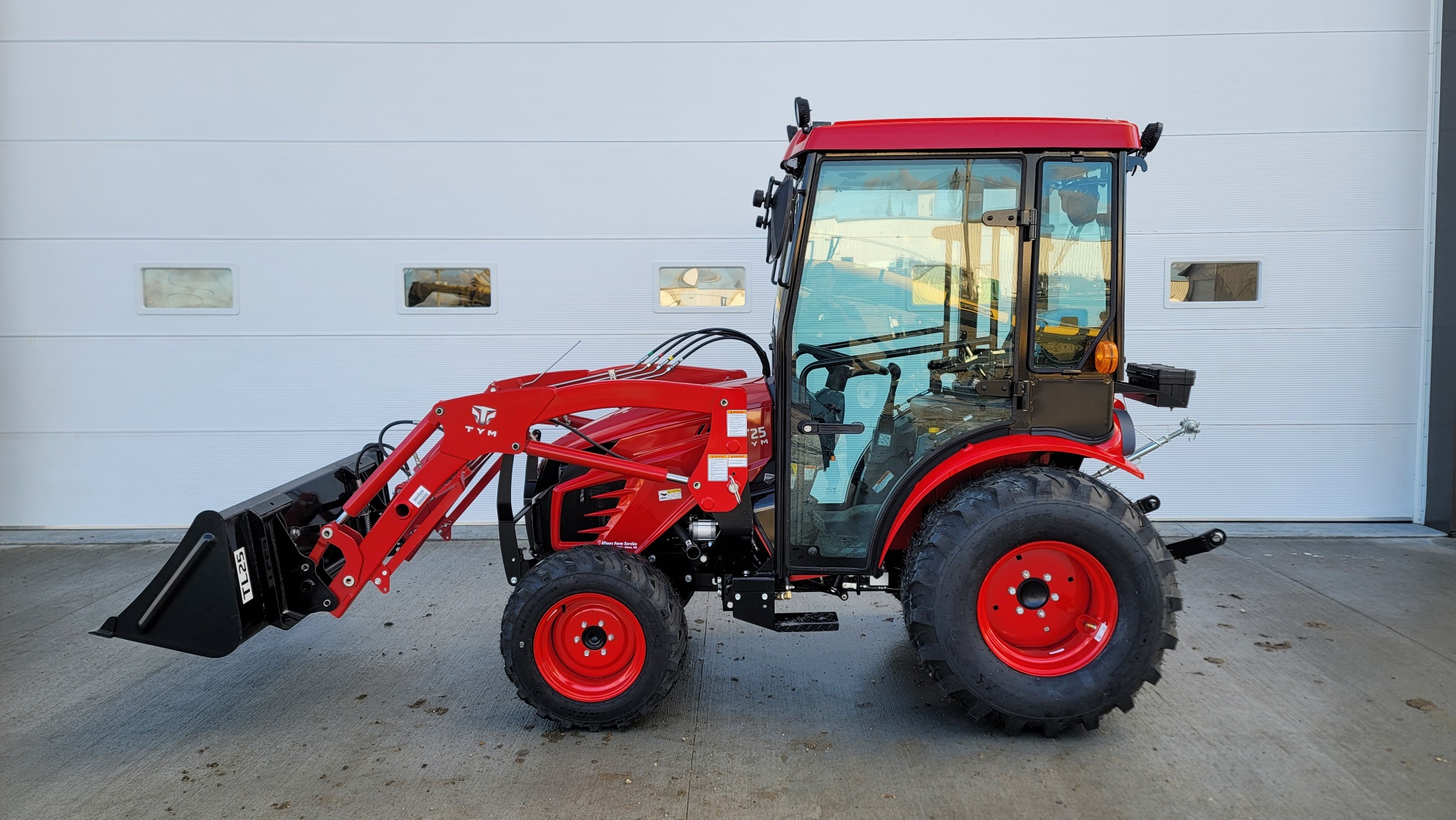 https://altonafarmservice.ca/wp-content/uploads/2023/11/2023-TYM-T25H-Sub-Compact-Tractor-with-Cab-1.jpg